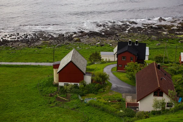 Red houses on a sea coast Stock Picture