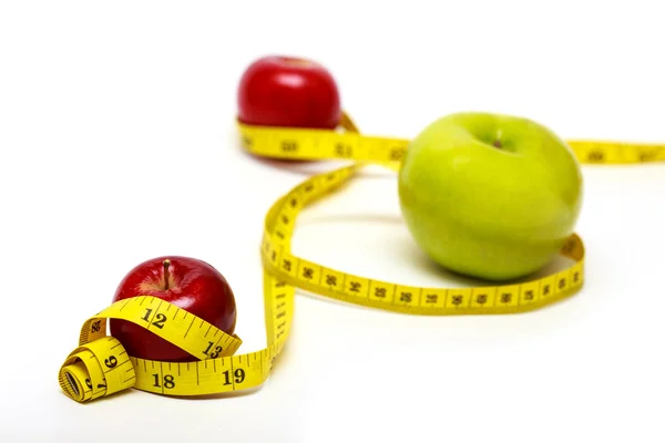 Apple and measuring tape — Stock Photo, Image