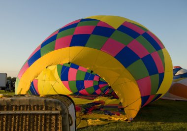 The envelope of a hot air balloon being inflated on the ground