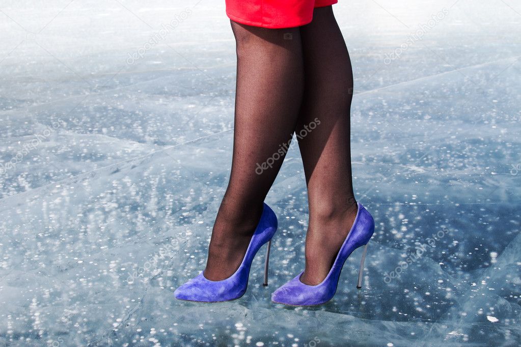 Intrekking vertaler familie Female feet in shoes with high heels standing on ice Stock Photo by  ©MomSirk 102955236