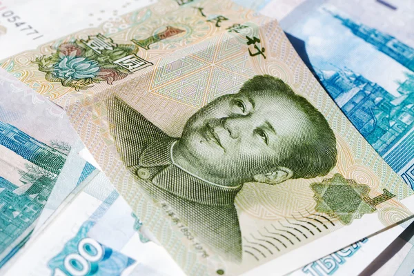 Chinese money background Russian rubles — Stock Photo, Image