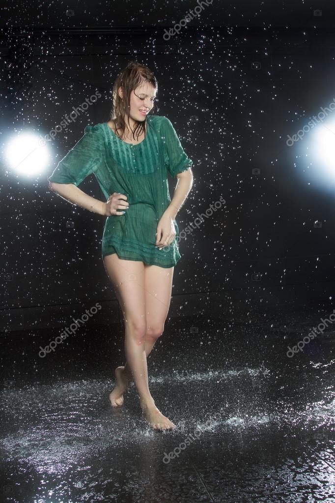 Young girl in a short dress wet Stock ...