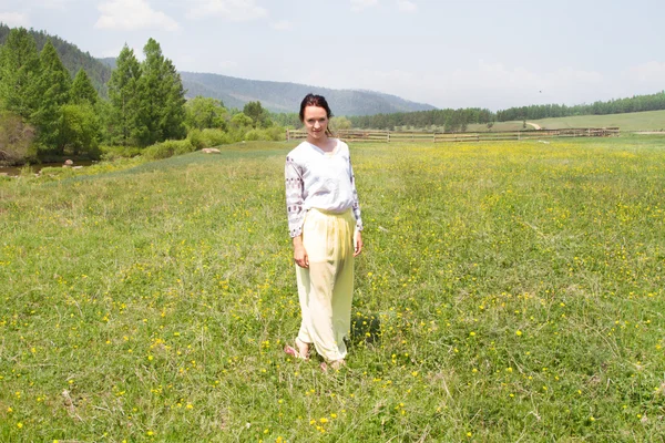 Girl on the background of a beautiful summer landscape — Stock Photo, Image