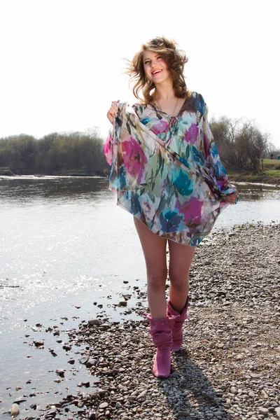 Girl in dress fluttering in the wind — Stock Photo, Image