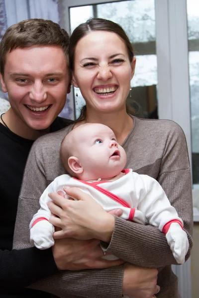 Happy parents with a small child — Stock Photo, Image