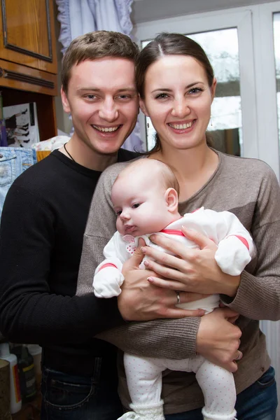 Happy parents with a small child — Stock Photo, Image