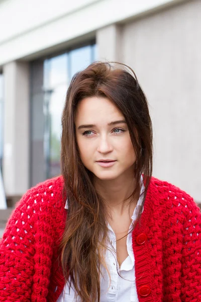 Young business woman in a red cardigan — Stock Photo, Image