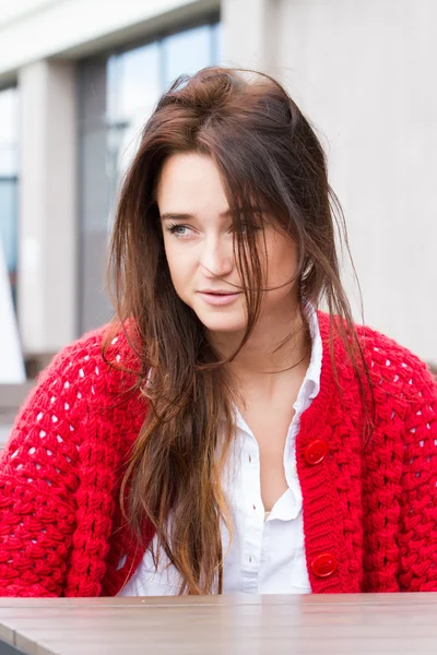 Young business woman in a red cardigan — Stock Photo, Image