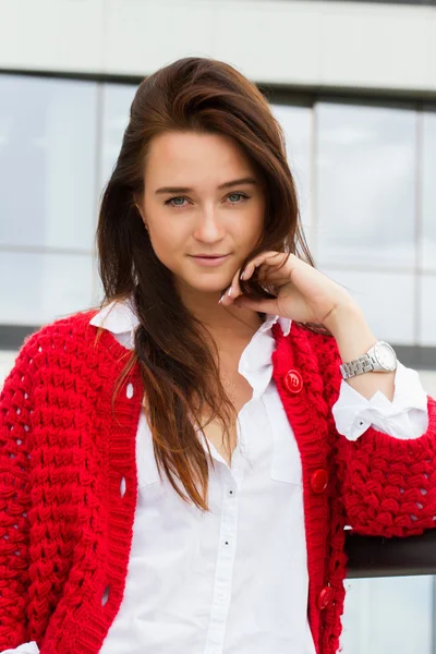 Young business woman in a red cardigan — Stock Photo, Image