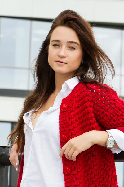 Young business woman in a red cardigan — Stock Photo, Image