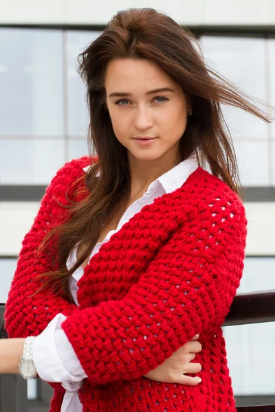 Young business woman in a red cardigan — Stock Photo, Image