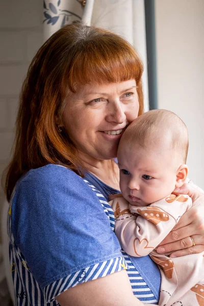 Grandmother Stands Room Window Her Little Grandson — Stock Photo, Image