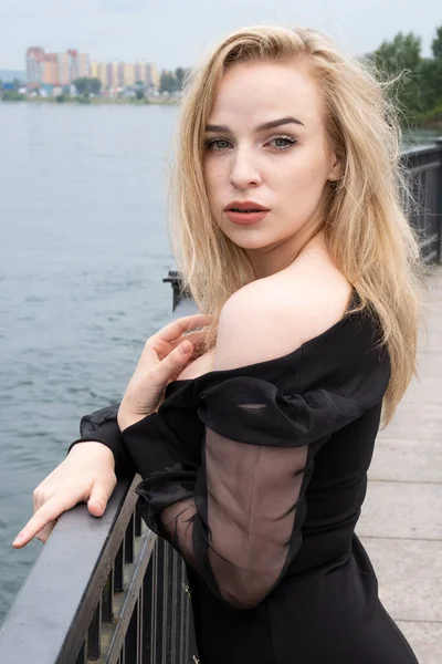 Emotional Blonde Black Dress Embankment Fence — 图库照片