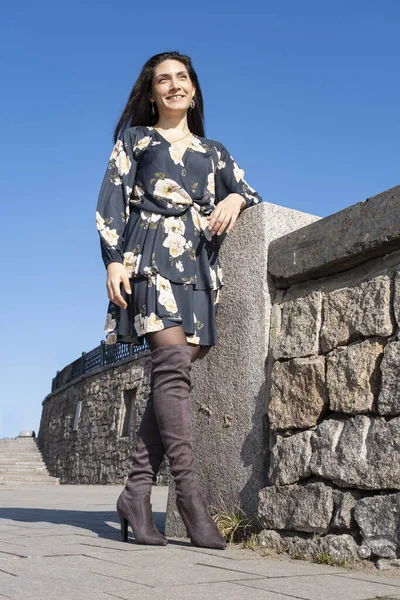 Young Woman Short Dress Stands Stone Fence — Stock Photo, Image