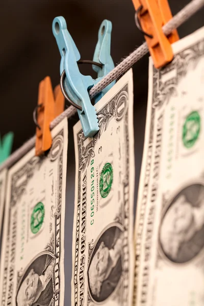 One dollar bills drying on the clothesline. The concept of money laundering — Stock Photo, Image