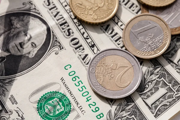 Euro coins and the ruble against the backdrop of the American dollar — Stock Photo, Image