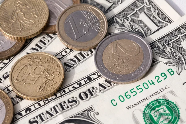 Euro coins and the ruble against the backdrop of the American dollar — Stock Photo, Image