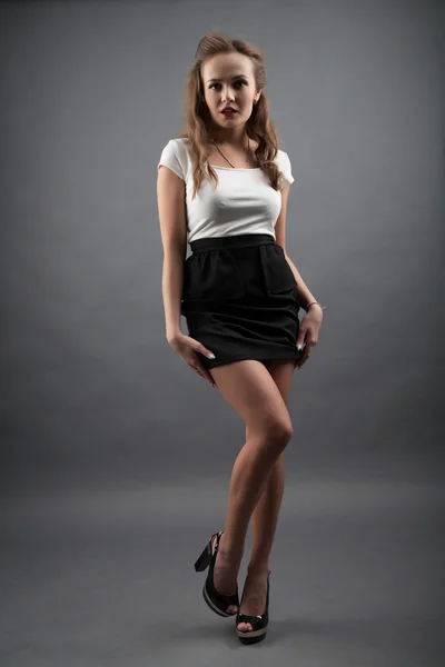 Girl in black skirt and white blouse — Stock Photo, Image