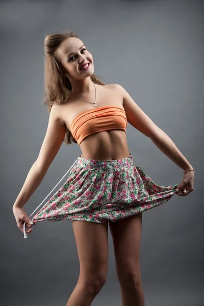 Girl in short skirt color. studio portrait — Stock Photo, Image