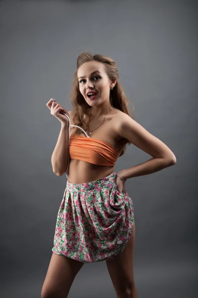 Girl in short skirt color. studio portrait — Stock Photo, Image