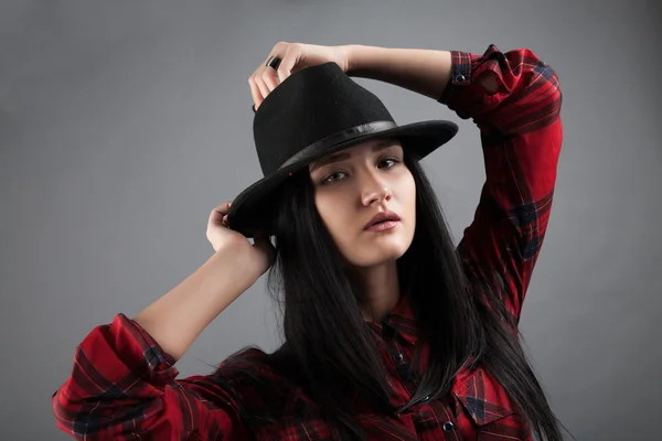 Girl in black hat. studio portrait — Stock Photo, Image
