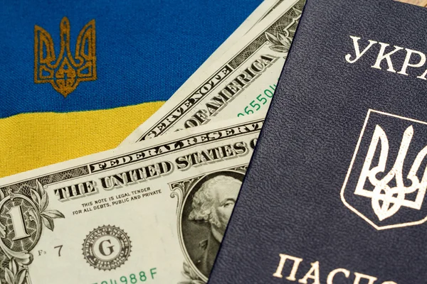 Ukrainian passport on the background of the flag of Ukraine — Stock Photo, Image