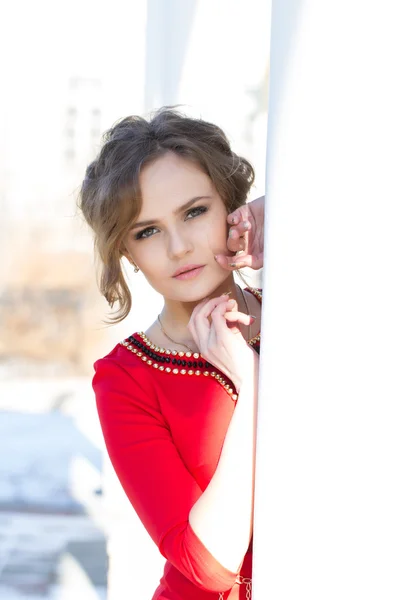 Portrait of a girl in a red dress — Stock Photo, Image