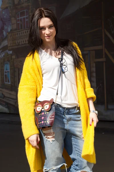 Young girl in a yellow coat — Stock Photo, Image