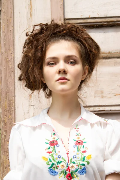Young girl in a white embroidered shirt — Stock Photo, Image