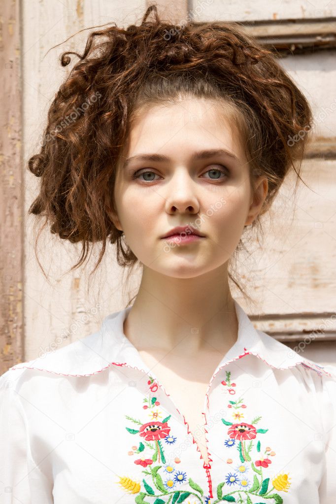 Young girl in a white embroidered shirt