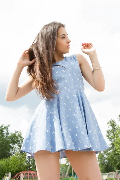 Young girl in a short dress — Stock Photo, Image