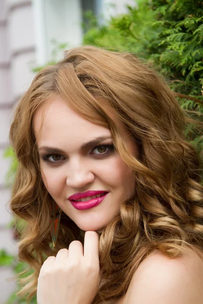 Girl with long curly hair — Stock Photo, Image