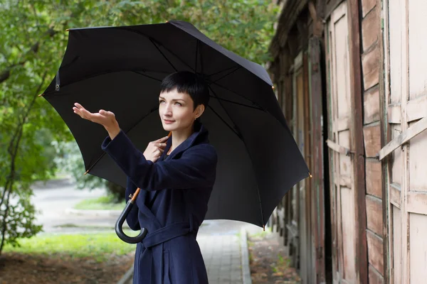 The girl with an umbrella on the streets of the old town — Stock Photo, Image