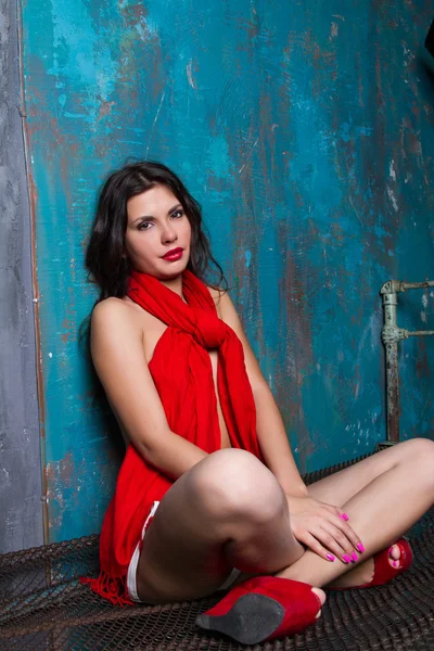 Portrait of a young girl with a red scarf — Stock Photo, Image