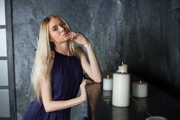 Young blonde with candles — Stock Photo, Image
