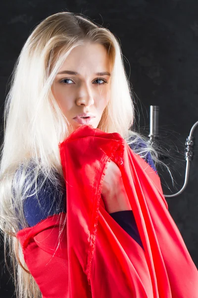 Young blonde with a red scarf in the window — Stock Photo, Image