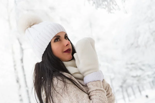 Girl in the woods among the snowy trees — Stock Photo, Image