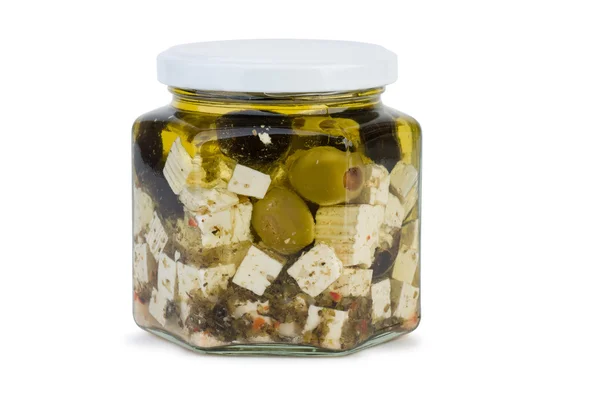 Glass jar with fitaki cheese in oil and olives — Stock Photo, Image