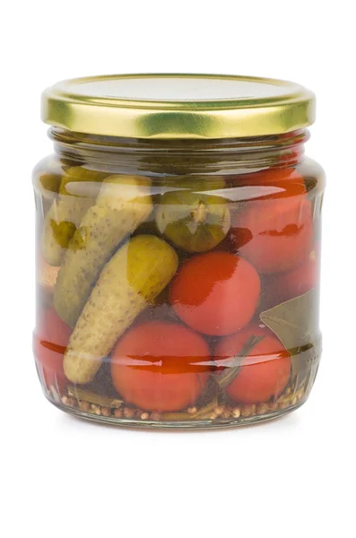 Glass jar with pickled tomatoes and cornichons — Stock Photo, Image