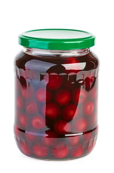 Glass jar with preserved cherries — Stock Photo, Image