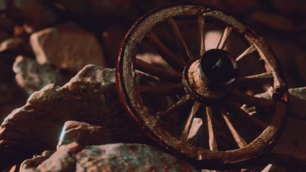 Old wooden wheel on rocks — Stock Footage Old wooden wheel on rocks Royalty Free Stock Video