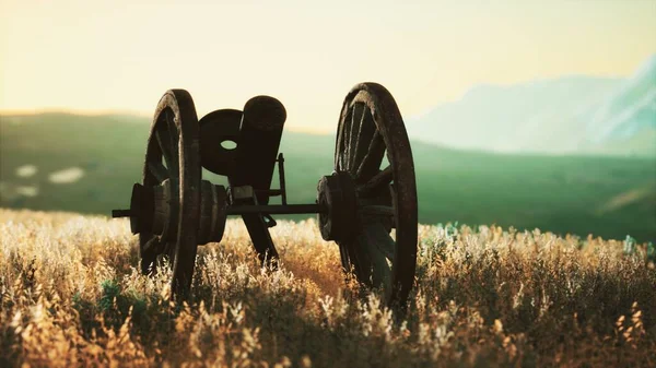 historic war gun on the hill at sunset