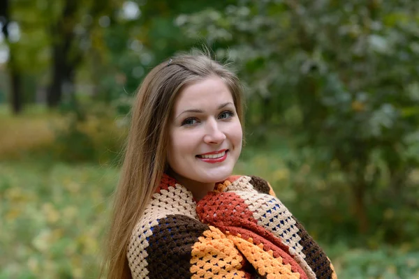 Young woman is warmed by a scarf Royalty Free Stock Photos