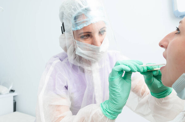 Medical worker taking a swab for coronavirus. Covid-19.