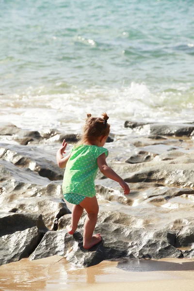 Little girl on sandy beach — Stock Photo, Image