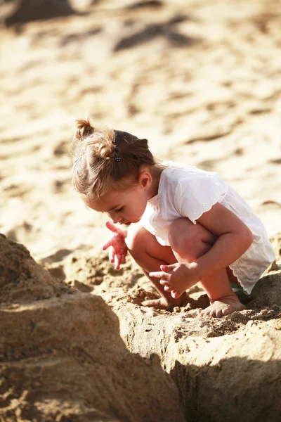 Little girl on sandy beach — Stock Photo, Image