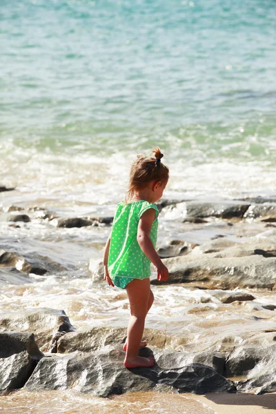 Little girl on sandy beach — Stock Photo, Image