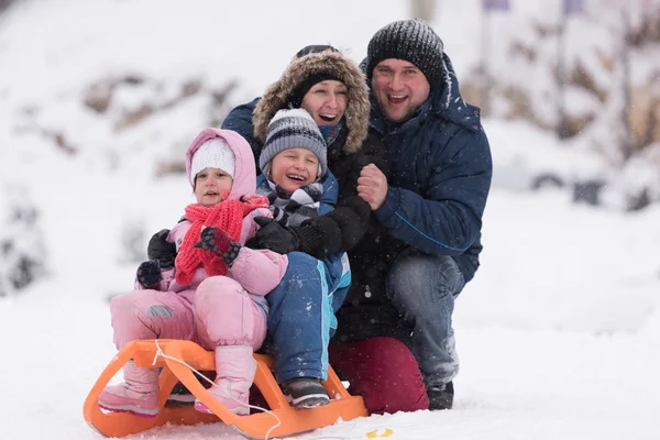 Happy Young Family Portrait Winter Vacation While Sitting Sledge Landscape — Stock Photo, Image