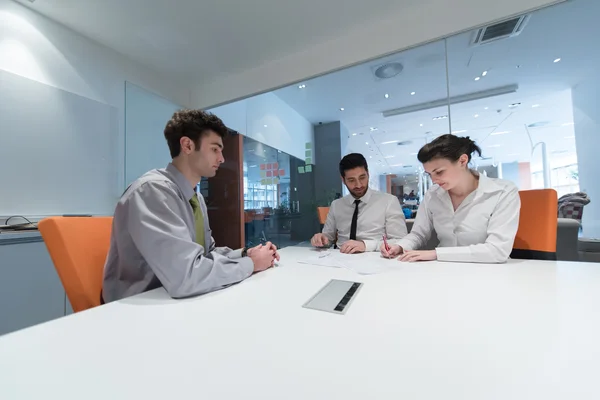 Young couple signing contract documents on partners back — Stock Photo, Image