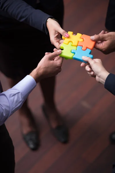Top view of business people group assembling jigsaw puzzle — Stock Photo, Image
